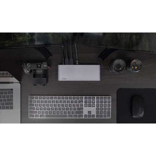 Top down view of the USB-C HDMI Dock on a desk connected to two monitors, a wireless keyboard and a MacBook Pro. A camera is also on the desk.