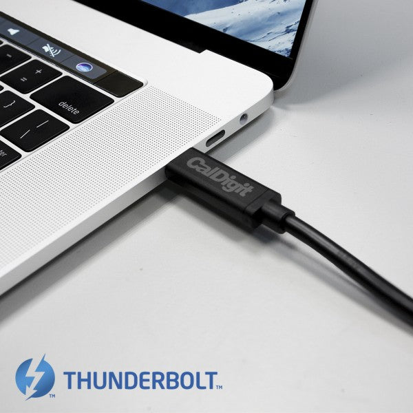 CalDigit Thunderbolt cable connected to a MacBook Pro, and the Thunderbolt logo.